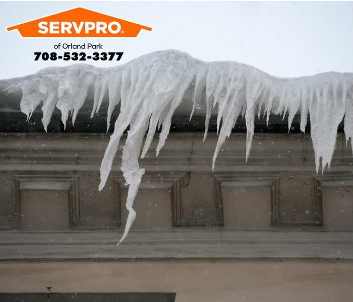 Icicles cling to a roof.